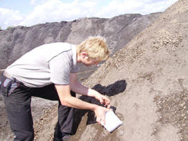 Henrik Pedersen takes samples of the ash